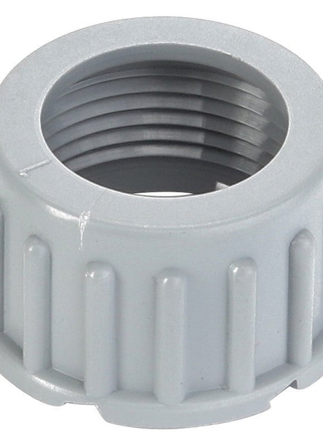 A close-up view of the AGCO | CAP - D45010108, a gray plastic threaded cap with ridges for grip, designed without a detailed product description and likely used as a protective or sealing component in various applications.