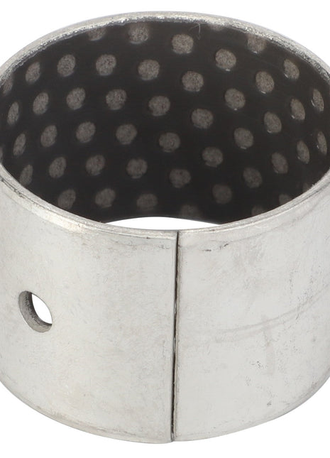 - Product Name: AGCO | Bush - La321933750
- Brand Name: AGCO

A metallic cylindrical component named AGCO | Bush - La321933750, manufactured by AGCO, has a dotted inner surface and features a seam with a small circular hole near the seam.