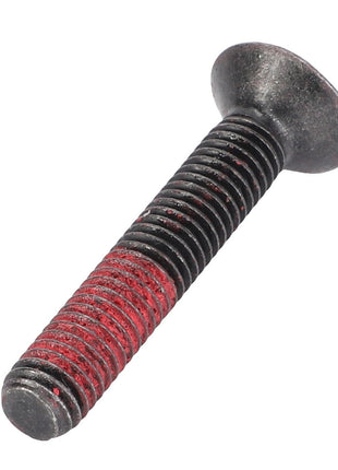A countersunk capscrew, model F930500030200 from AGCO, with red thread locker applied to its threaded section.