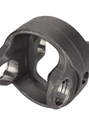 The AGCO Center Part, Knuckle - F835300020550 is a metallic yoke with a hollow center and two symmetrical arms featuring cylindrical openings on each side. Crafted from high-grade cast iron using CNC technology for precision, it is ideal for mechanical or automotive applications.