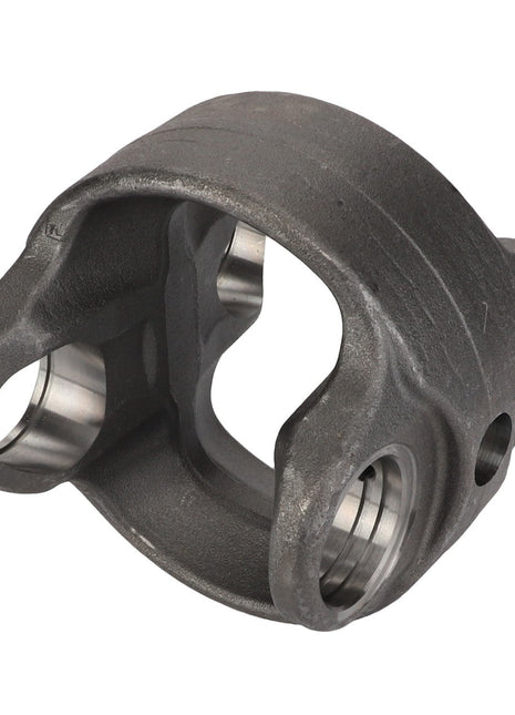 The AGCO Center Part, Knuckle - F835300020550 is a metallic yoke with a hollow center and two symmetrical arms featuring cylindrical openings on each side. Crafted from high-grade cast iron using CNC technology for precision, it is ideal for mechanical or automotive applications.