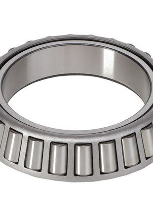 Close-up image of the AGCO | BEARING CONE - AG706729 displaying its metal outer ring and cylindrical rollers. This tapered roller bearing is designed to handle high radial and thrust loads, making it ideal for use in the off-road industry.