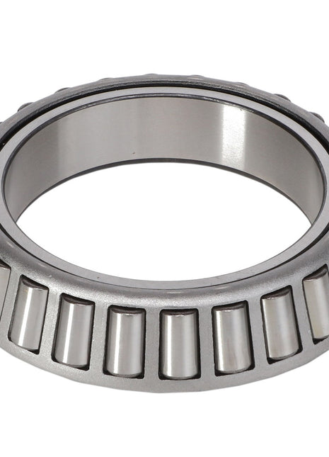 Close-up image of the AGCO | BEARING CONE - AG706729 displaying its metal outer ring and cylindrical rollers. This tapered roller bearing is designed to handle high radial and thrust loads, making it ideal for use in the off-road industry.