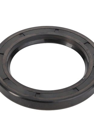 The AGCO Oil Seal - Acp0369580 is a black rubber sealing ring with a circular shape and grooved surface, commonly used in mechanical or automotive applications for enhanced performance and reliability.