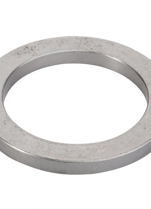 A close-up image of the AGCO Spacer - Acp0444930, a metal washer with a circular shape and a central hole. No current product description available.