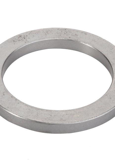 A close-up image of the AGCO Spacer - Acp0444930, a metal washer with a circular shape and a central hole. No current product description available.