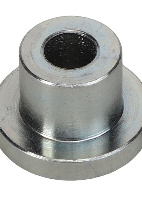 The AGCO SLEEVE - ACP0410750 is a metal spacer with a cylindrical body and a central hole, all set neatly on a wider flat base.
