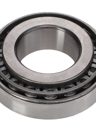 A close-up image of the AGCO | Bearing Set - Acp0287090, showcasing its cylindrical roller bearings with metal rollers arranged in a circular pattern inside a metal casing. No current product description available for this product.