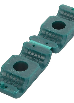 The AGCO | CLAMP - D26732813 is a green plastic clamp featuring two circular holes and a sleek, curved design, making it perfect for securing pipes or cables.