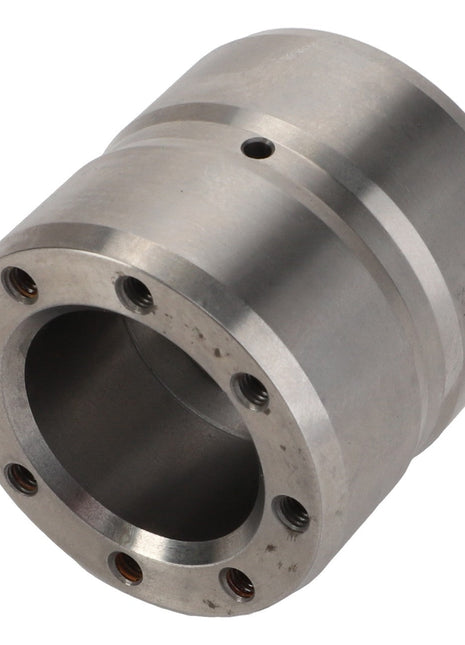 The AGCO Bearing Carrier - D28600161 is a cylindrical metal component featuring eight evenly spaced holes around one end and three concentric grooves near the middle, exemplifying precise engineering.