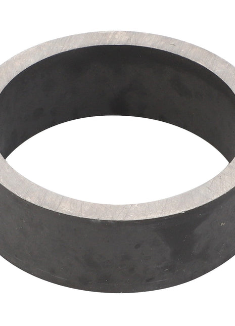 The AGCO RING - F743300021150 features a close-up view of its cylindrical metal design with a hollow center, showcasing smooth edges and a matte grey finish.