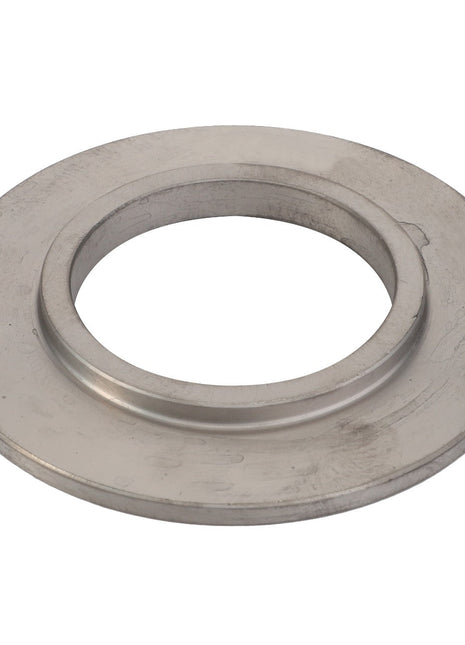 The AGCO Disc - F184108080374, featuring a circular metal flange with a large central hole, is viewed from an overhead perspective to highlight its sleek and precise design.