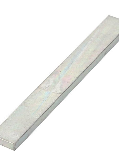 A rectangular metallic flat bar with a smooth, reflective surface, shown against a white background. This product is the AGCO Shim - La300018297 from AGCO. No current product description available for this item.