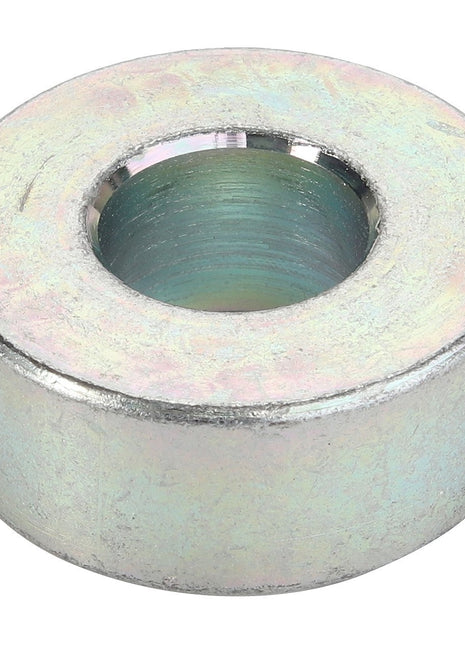 A metallic, cylindrical spacer with a central hole, viewed from a slightly elevated angle. This is the AGCO | Spacer - Acw0445790 by AGCO. Currently, no product description information is available.