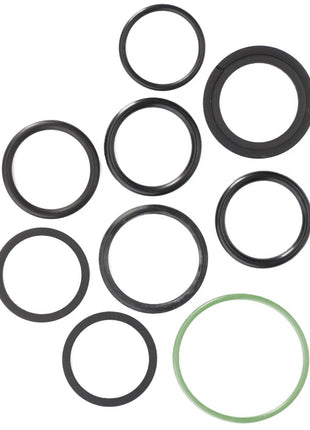 A set of nine circular rubber O-rings from the AGCO Seal Kit, Hydraulic Coupling - F514960100030, often used as seals or gaskets, in various sizes with one green O-ring among the black ones, arranged against a white background.