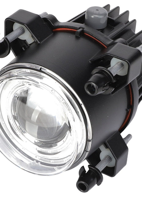 Close-up of the AGCO Headlamp - Acx2333710, a round, black automotive headlight assembly featuring a clear lens and multiple mounting brackets with screws.