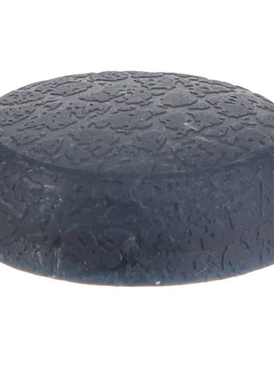 The AGCO | CAP - D45749800 by AGCO is a round, textured rubber foot pad designed to provide a non-slip base for objects such as furniture or electronics, ensuring stability and protection.