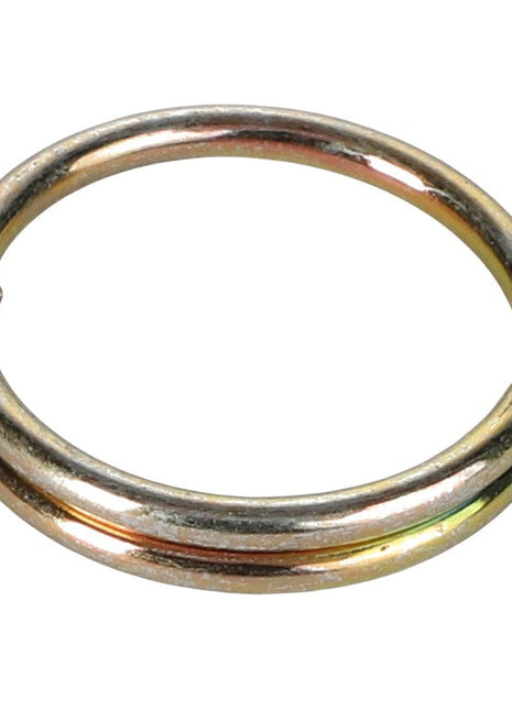 A vintage AGCO ring (F716872060080) featuring a single coil, slightly tarnished, elegantly displayed against a pristine white background.