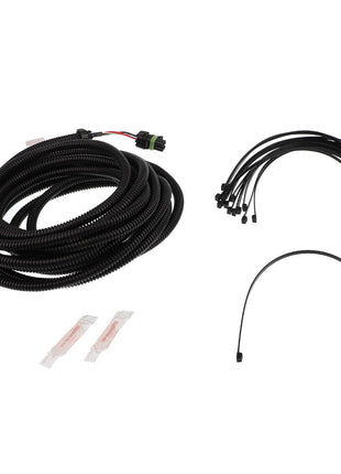 The AGCO | CABLE - AG428729, a coiled black wire harness featuring various connectors, comes with zip ties, a single black wire, and two small packets that likely contain lubricant or adhesive. Unfortunately, no further product description information is available at the moment.