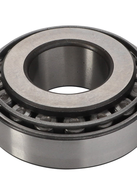 A close-up of the AGCO Taper Roller Bearing - F198300020481, showcasing an outer ring, inner ring, and multiple cylindrical rolling elements arranged in a conical formation designed to handle both radial and thrust loads effectively.