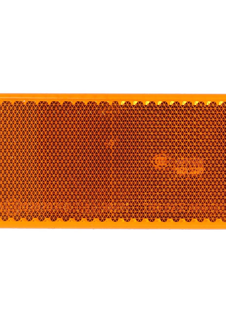 The AGCO Reflector - D45084600 is a rectangular orange reflector featuring a honeycomb pattern and rounded edges, designed to ensure optimal illumination.