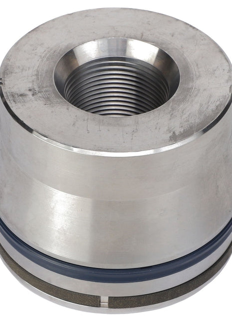 The AGCO PISTON - AL12709012 is a cylindrical machine part made of metal, featuring a threaded hollow center and equipped with a rubber seal around its base.
