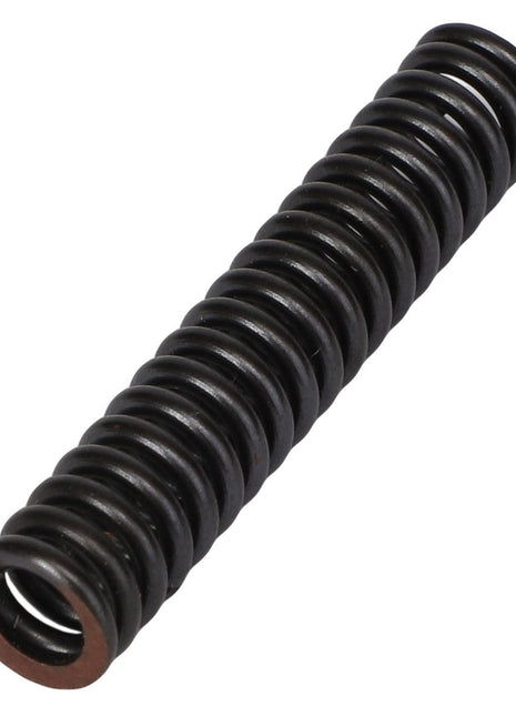 A black, cylindrical metal spring (Product: AGCO | SPRING - AG133562) rests horizontally on a white background. Current product information is provided by the brand AGCO.