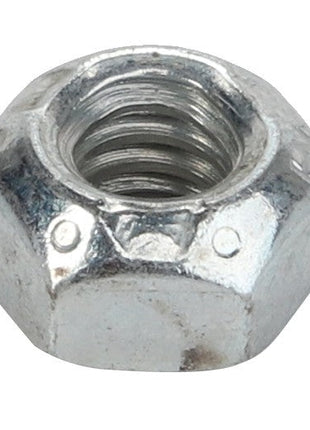 Close-up of the AGCO Top Lock Nut - Acp0040990, a hexagonal metal nut featuring internal threading, set against a white background. No current product description available.