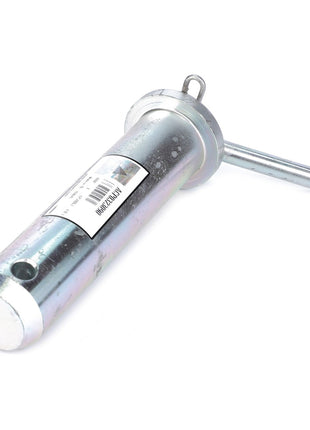 The AGCO Pin - Acp0323090 is a metal hitch pin that features a cylindrical body, a horizontal locking pin, and a label with barcoded information for easy identification.