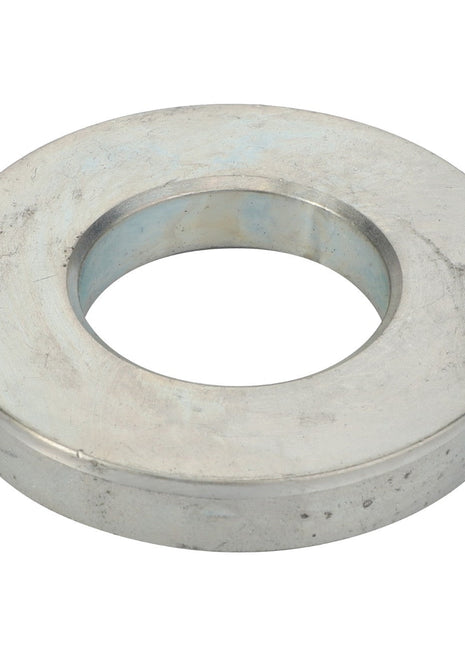 The AGCO | WASHER - D28150131 is a silver metallic washer with a central circular hole, utilized in various mechanical and structural applications. No current product description information is available.