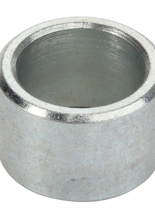 A close-up view of the AGCO SPACER - D28751140, a cylindrical metal bushing with a hollow center and a silver finish. No current product description information is available.