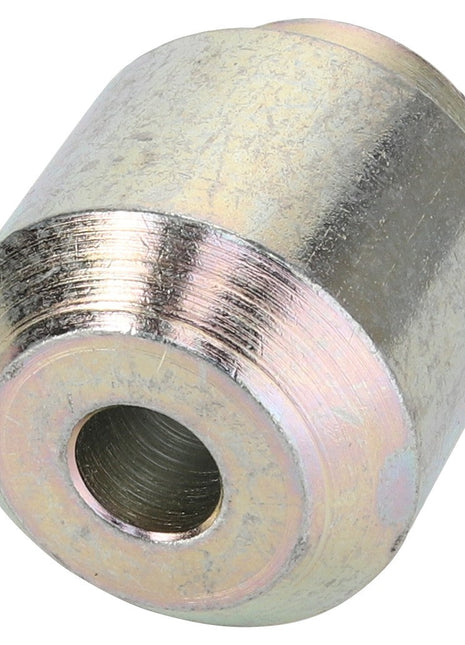 The AGCO Bush - Acw8516960 is a cylindrical metal spacer with a central hole, featuring a shiny, reflective finish.