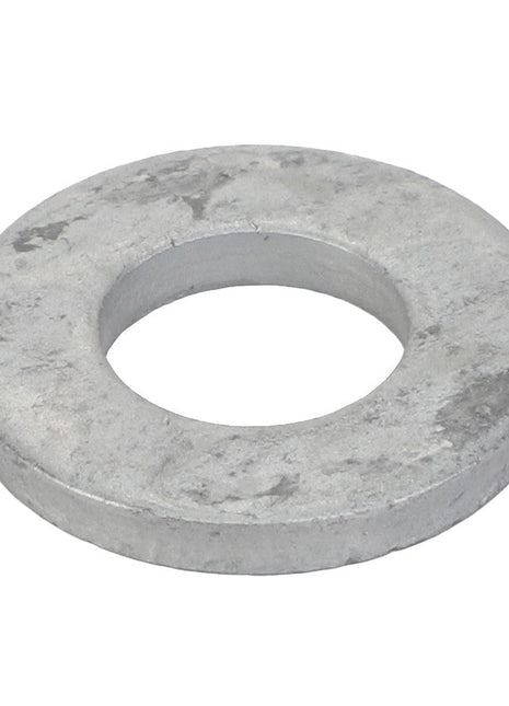 The AGCO | Washer - Acp0705070, a product by AGCO, is a metallic flat washer featuring a circular outer edge and a central hole, designed to distribute the load of a threaded fastener.