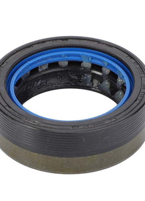 A close-up image of the AGCO Shaft Seal - F199300020310 featuring a black and blue rubber exterior and an inner metal ring displays intricate craftsmanship.