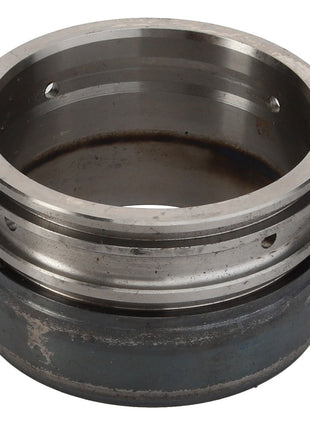 A slightly worn AGCO Bush (411151150070) metal cylindrical component with a hollow center and grooves, resembling those found in Valtra or Massey Ferguson machinery.