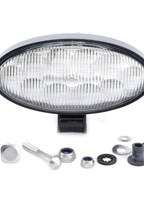 The AGCO Work Light, LED (ACW0607820) is an oval-shaped vehicle headlight from AGCO Parts that comes with mounting hardware, including bolts, nuts, washers, and rubber grommets arranged below it. Featuring a clear lens with a patterned reflector, these LED work lights ensure optimal visibility.