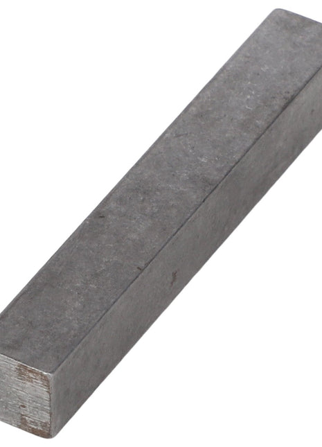 A rectangular metallic bar labeled AGCO | KEY - AG707143, featuring a smooth surface and likely composed of steel or aluminum, isolated on a white background. The current product description is not available.