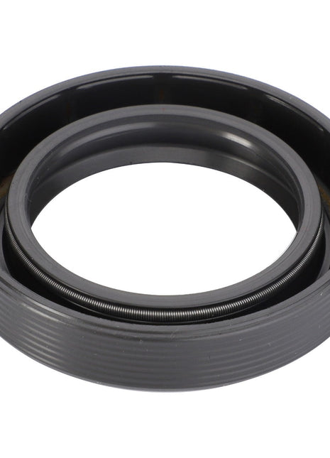 The AGCO Shaft Seal - F184300020630 is a high-performance black rubber and metal oil seal ring with a robust internal spring mechanism, meticulously designed for sealing lubricants in advanced machinery.