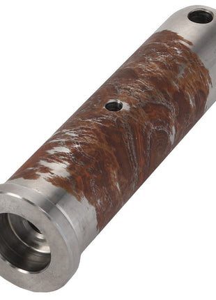 The AGCO Shaft - Al522491 is a cylindrical metal component exhibiting rust and corrosion, designed with two holes along its length and a larger opening at one end. Currently, there is no detailed product description available.