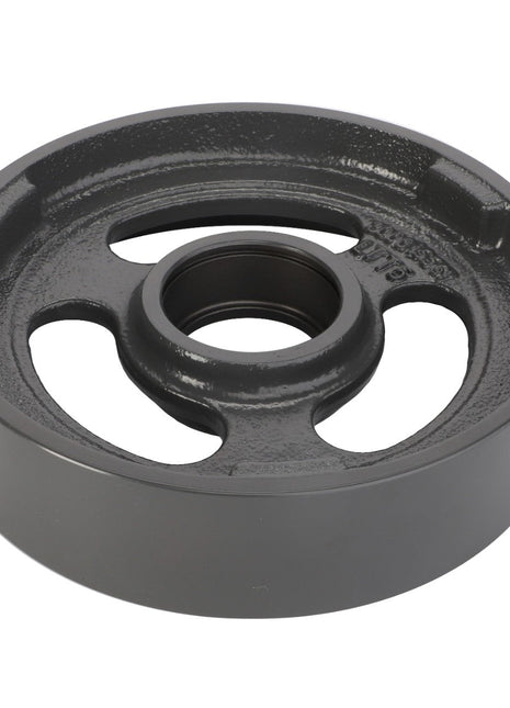 Take a close look at the AGCO Idler Pulley (La300015561), constructed from heavy-duty cast iron. This component features a central hole and three elongated slots, tailored for industrial machinery or mechanical applications. The wheel is dark grey with a smooth, polished surface, embodying both durability and precision. Note: No current product description available for this item.