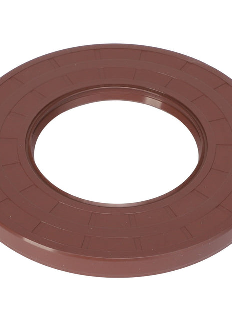 Introducing the AGCO | LIP SEAL - ACP0287670, a circular brown plastic ring with a smooth outer surface and a hollow center, resembling a large washer. For further details or ordering information, please contact our support team.