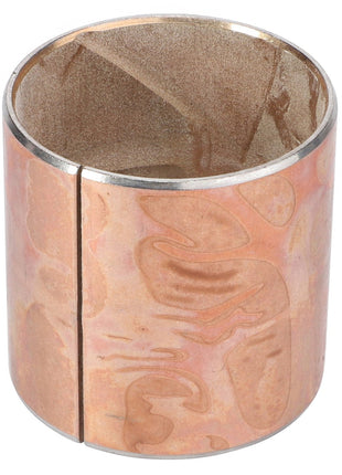 The AGCO Thimble - La320942450, a copper cylindrical object with a side slit and slightly uneven surface texture, is likely used as a bushing or sleeve.