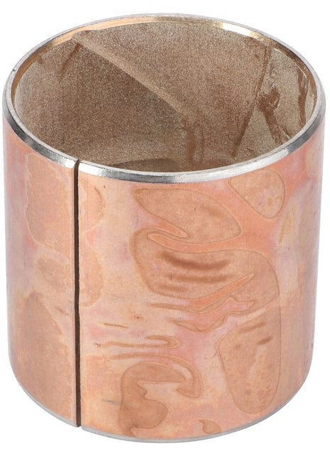The AGCO Thimble - La320942450, a copper cylindrical object with a side slit and slightly uneven surface texture, is likely used as a bushing or sleeve.