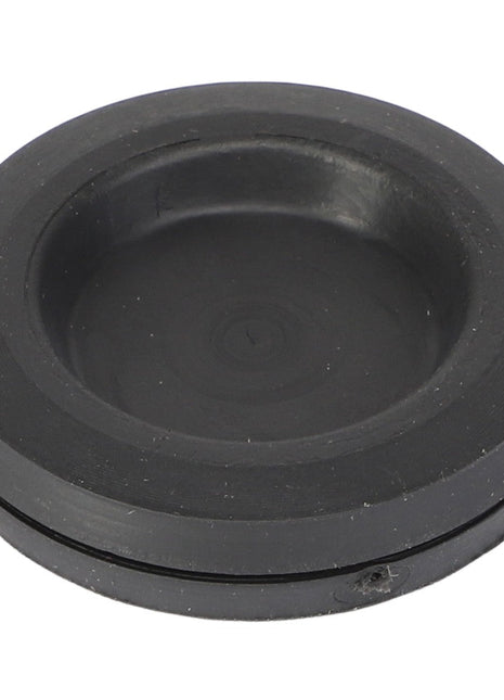 Currently, there is no detailed product description available. However, it seems to be the AGCO RUBBER INLET - V30176200, a round, black rubber grommet featuring a slightly indented center and a raised edge.