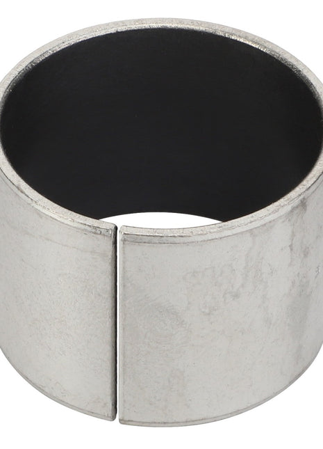 Close-up of the AGCO LINING - D43339500, a metallic cylindrical object with an open seam running vertically along its side.