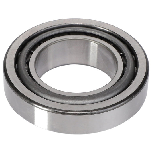 A close-up image of the AGCO Tapered Roller Bearing Assembly - 1110003, featuring an inner and outer ring, commonly used in machinery to reduce friction between moving parts. No current product description available.