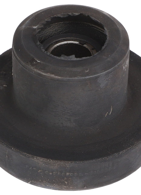 Close-up of an AGCO | BONDED MOUNT - AG519388, a black, cylindrical rubber bushing with a metal core, showing wear and tear around the edges. No current product information is available for this specific item.