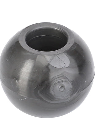 A black, round plastic AGCO Nut Ø14mm with a hollow center, designed for maximum uptime and peak efficiency, resembling a spherical socket joint bearing.