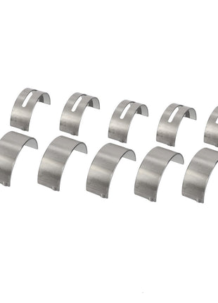 Nine metal semicircular bearing shells meticulously arranged in three orderly rows from the AGCO Kit, Bearing - Acp0318610.