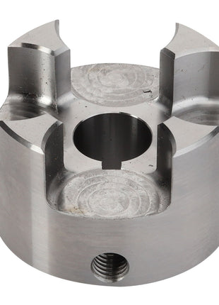 The AGCO | CLUTCH - D28730181 is a metallic cylindrical component featuring a central hole and four symmetrical slots, designed for mechanical purposes. Detailed product description information is currently unavailable.